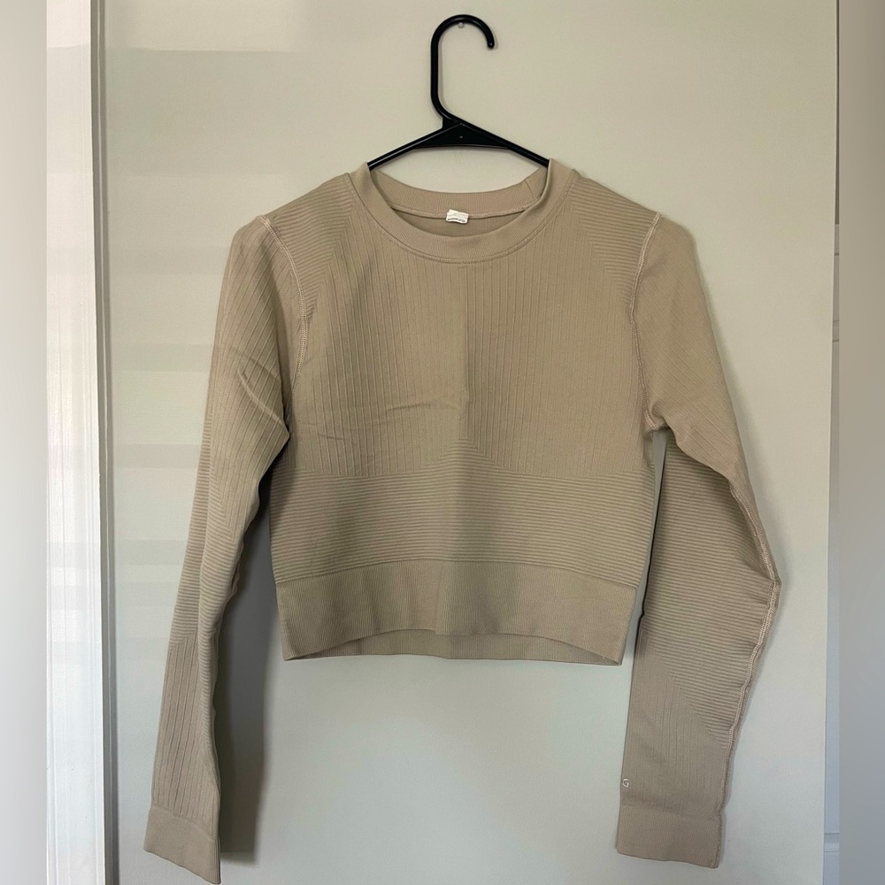DSG beige long sleeve workout top. Stretchy material very supportive. Size M